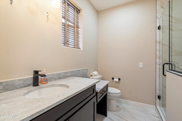 bathroom featuring a shower with shower door, vanity, and toilet