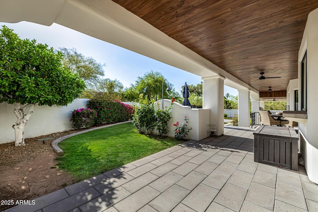 view of patio featuring a ceiling fan and a fenced backyard