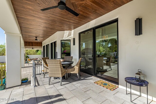 view of patio / terrace with a ceiling fan and outdoor dining space