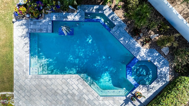 drone / aerial view of a pool