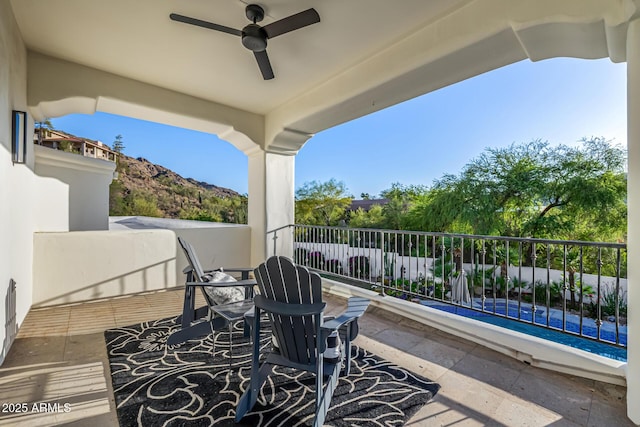 view of patio / terrace featuring a balcony and ceiling fan