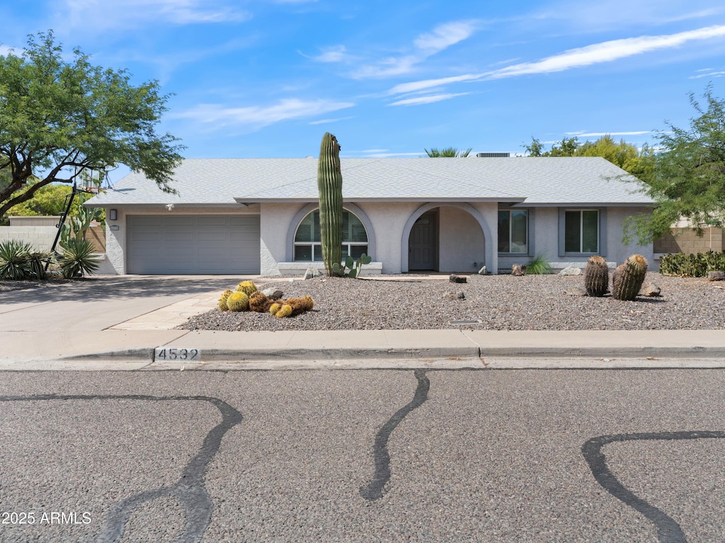 single story home with a garage