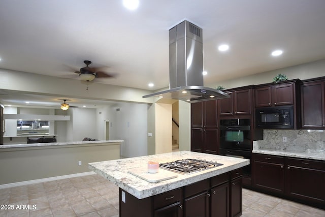 kitchen with island exhaust hood, light countertops, a ceiling fan, and black appliances