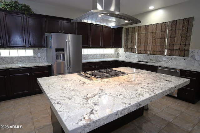 kitchen with tasteful backsplash, a center island, appliances with stainless steel finishes, island range hood, and a sink