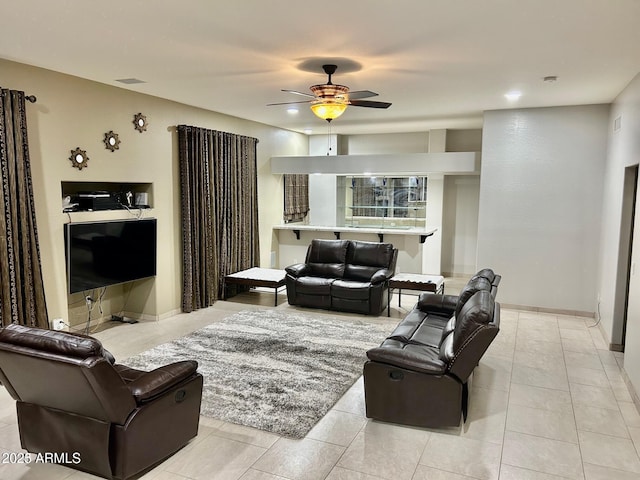 living room with light tile patterned flooring, ceiling fan, baseboards, and visible vents