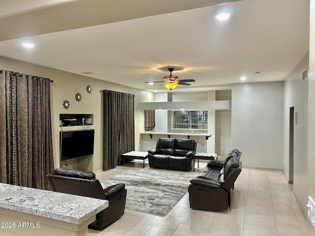 living area featuring ceiling fan, light tile patterned floors, visible vents, recessed lighting, and baseboards