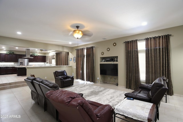 living room featuring recessed lighting, light tile patterned floors, and ceiling fan