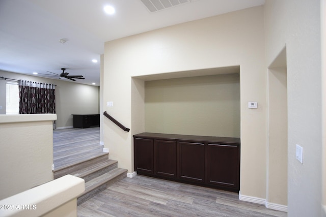 interior space with wood finished floors, a ceiling fan, visible vents, and recessed lighting