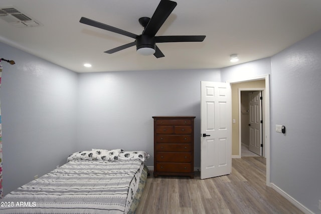 bedroom with baseboards, recessed lighting, visible vents, ceiling fan, and wood finished floors