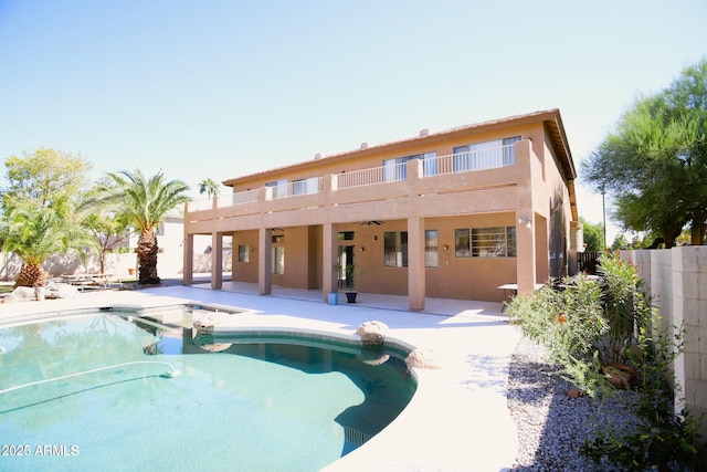 view of pool with a patio area, ceiling fan, fence, and a fenced in pool