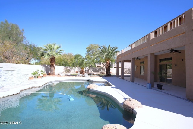 view of pool featuring a patio, a fenced backyard, a fenced in pool, and a ceiling fan