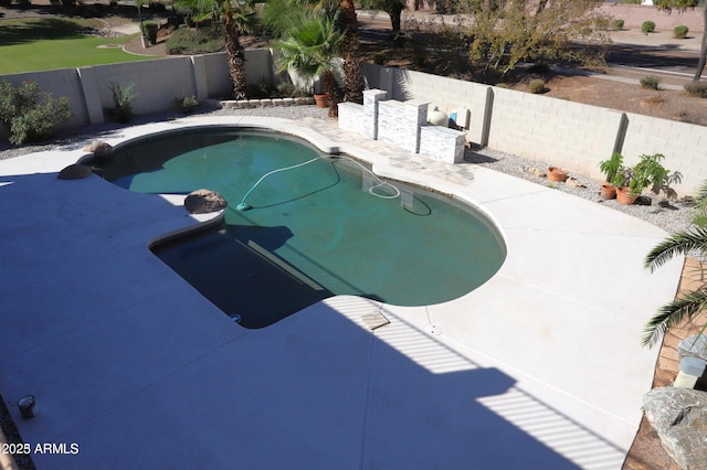 view of swimming pool featuring a fenced in pool and a fenced backyard