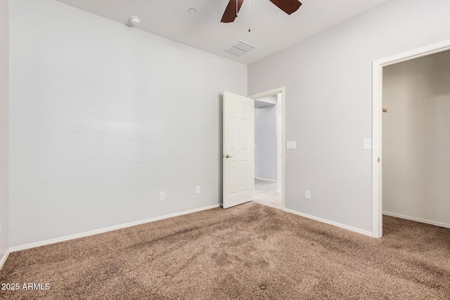 unfurnished bedroom with carpet floors, baseboards, and ceiling fan