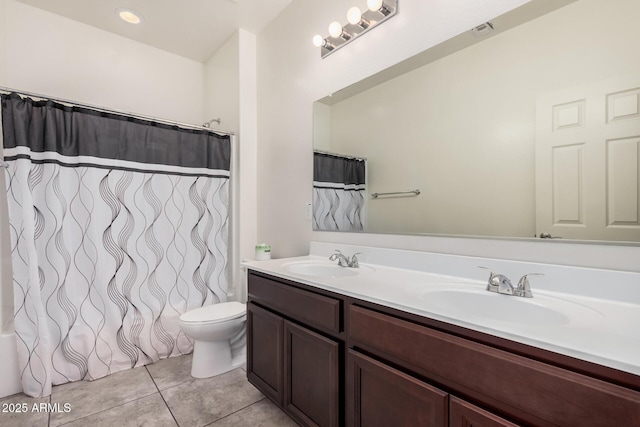 bathroom with tile patterned floors, toilet, double vanity, and shower / bathtub combination with curtain
