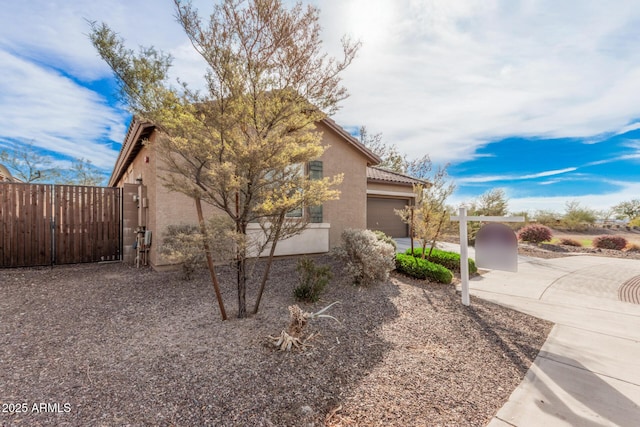 view of property exterior with a garage