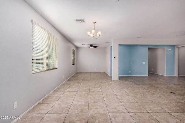 spare room with a chandelier, light tile patterned floors, baseboards, and a ceiling fan