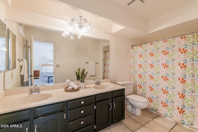 bathroom with an inviting chandelier, a shower with curtain, tile patterned floors, vanity, and toilet