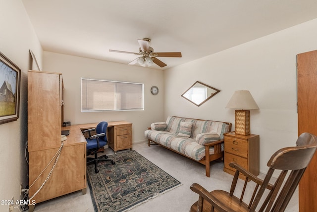 home office with a healthy amount of sunlight, light colored carpet, and ceiling fan