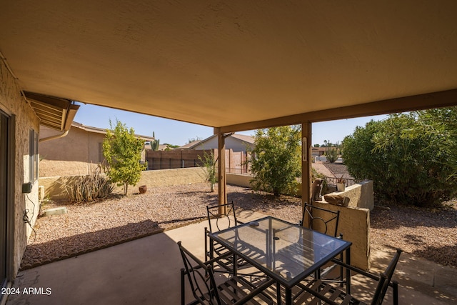 view of patio / terrace featuring outdoor dining space and fence