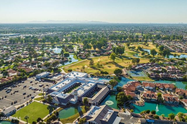 birds eye view of property with a water view and a residential view