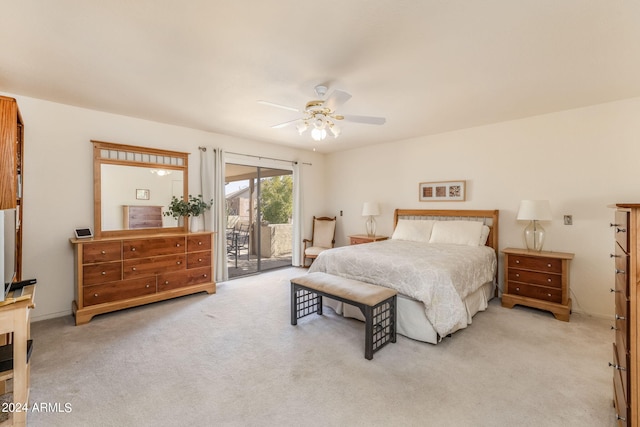 carpeted bedroom featuring ceiling fan and access to outside