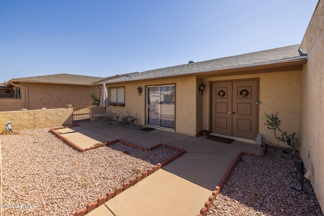 entrance to property with a patio