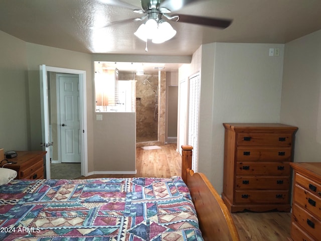 bedroom with connected bathroom, a closet, ceiling fan, and hardwood / wood-style floors