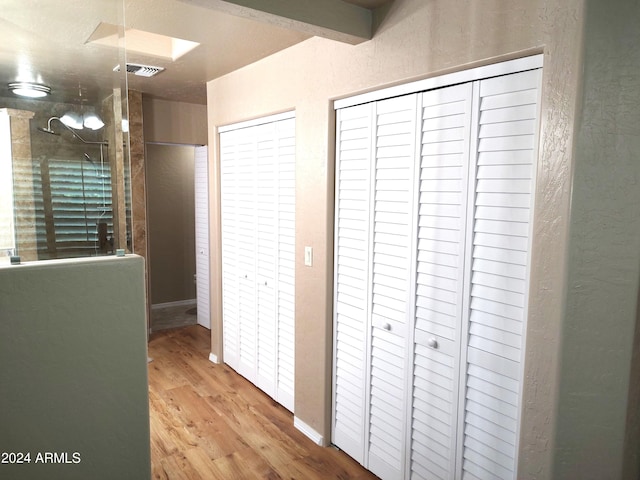 corridor featuring hardwood / wood-style flooring