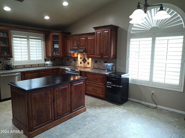 kitchen with decorative backsplash, dark brown cabinetry, stainless steel appliances, vaulted ceiling, and hanging light fixtures