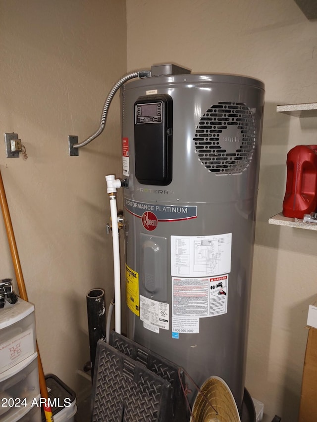 utility room featuring heat pump water heater