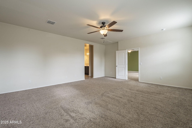 empty room with carpet and ceiling fan