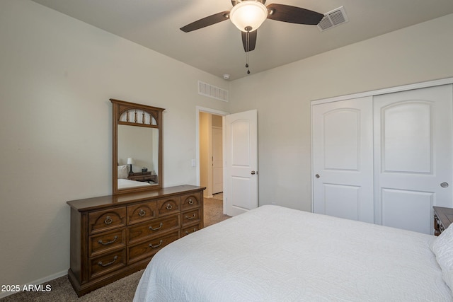 bedroom featuring ceiling fan, a closet, and carpet