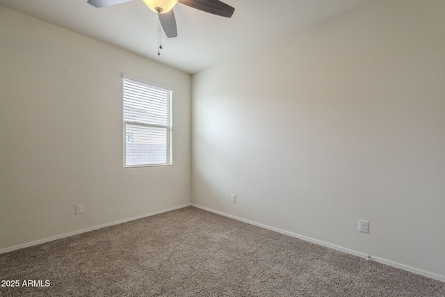 unfurnished room featuring ceiling fan and carpet flooring