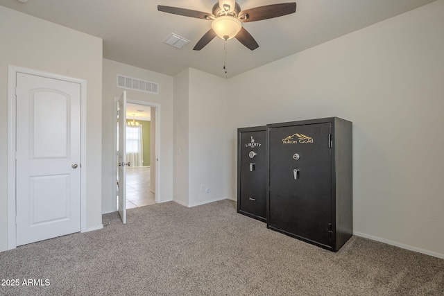 unfurnished bedroom with light carpet and ceiling fan