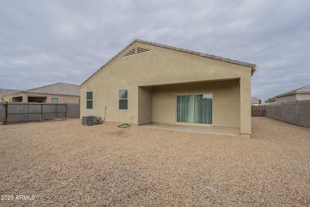 back of house with a patio and central air condition unit