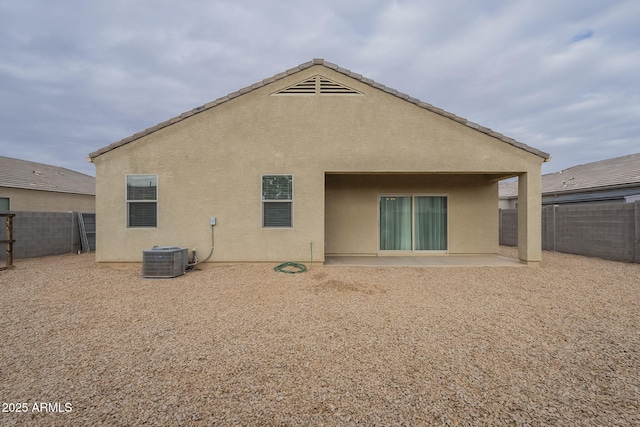 back of house with a patio and central AC