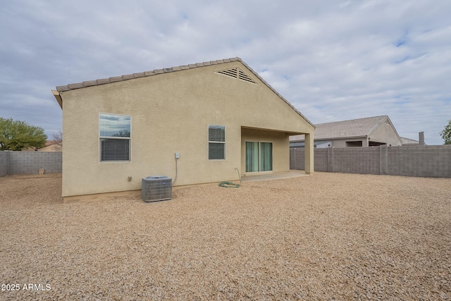 back of property featuring a patio area and central air condition unit