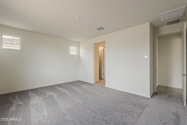 40030 W Bunker Dr, Maricopa, AZ 85138 - carpeted spare room with baseboards and visible vents