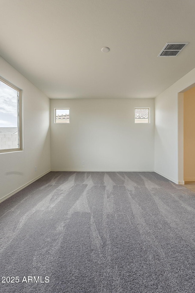 40030 W Bunker Dr, Maricopa, AZ 85138 - carpeted empty room featuring baseboards and visible vents