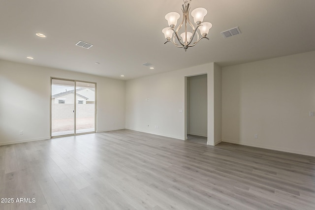 40030 W Bunker Dr, Maricopa, AZ 85138 - unfurnished room with a chandelier, recessed lighting, light wood finished floors, and visible vents