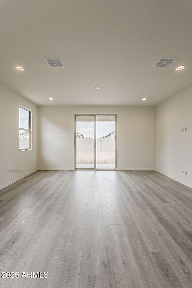 40030 W Bunker Dr, Maricopa, AZ 85138 - unfurnished room with a wealth of natural light, recessed lighting, and visible vents