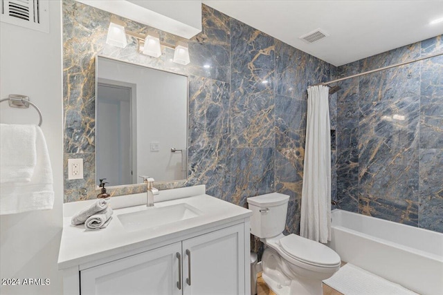 full bathroom with vanity, toilet, shower / bathtub combination with curtain, and tile walls