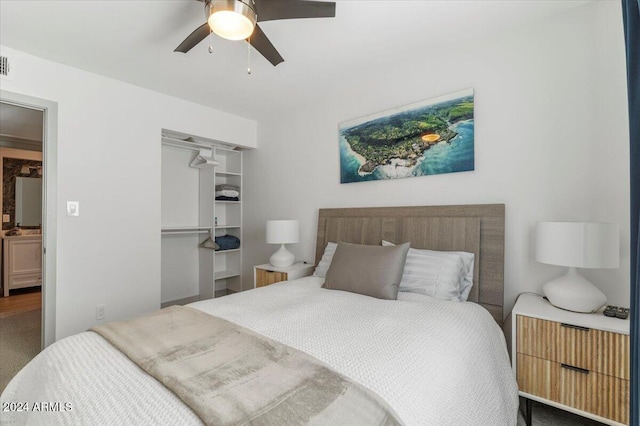 bedroom featuring ceiling fan and a closet