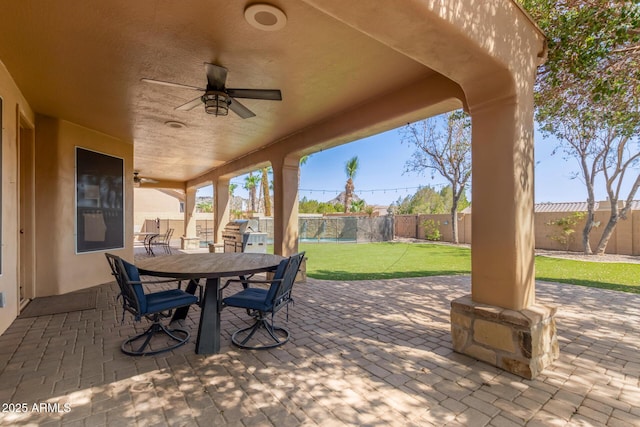 1211 E Desert Flower Ln, Phoenix, AZ 85048 - fenced backyard with ceiling fan, a patio area, and outdoor dining space