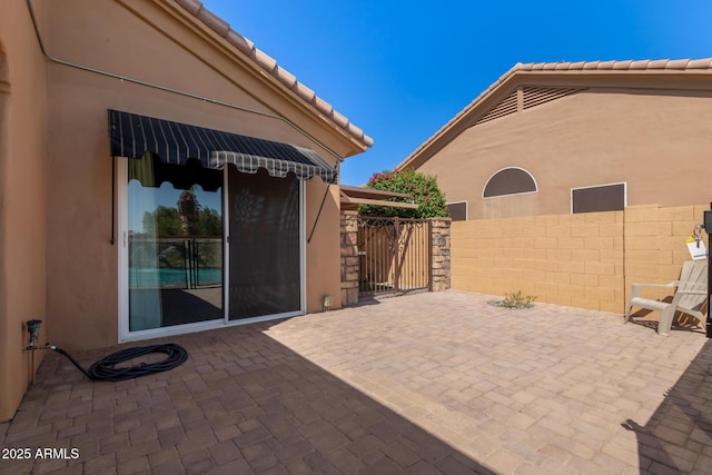 1211 E Desert Flower Ln, Phoenix, AZ 85048 - view of patio featuring a gate