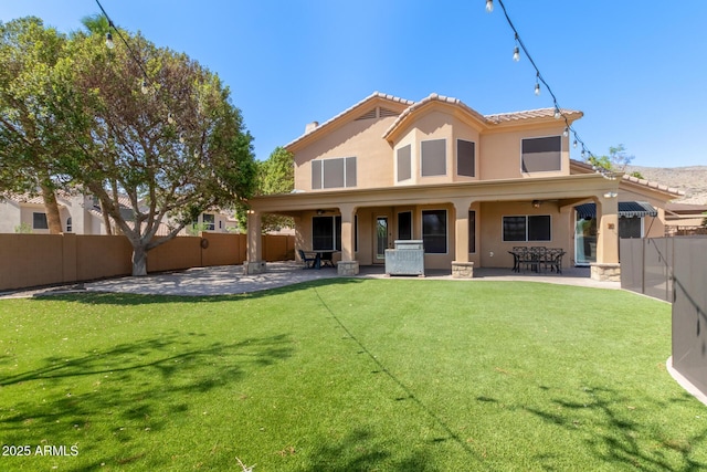 1211 E Desert Flower Ln, Phoenix, AZ 85048 - rear view of house with a patio, stucco siding, and a fenced backyard