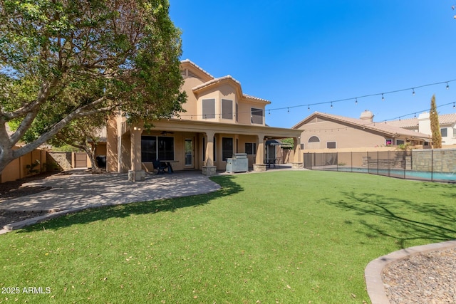 1211 E Desert Flower Ln, Phoenix, AZ 85048 - rear view of property with a fenced backyard, stucco siding, and a patio
