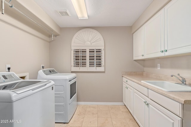 1211 E Desert Flower Ln, Phoenix, AZ 85048 - washroom with washer and clothes dryer, cabinet space, and light marble finish floors
