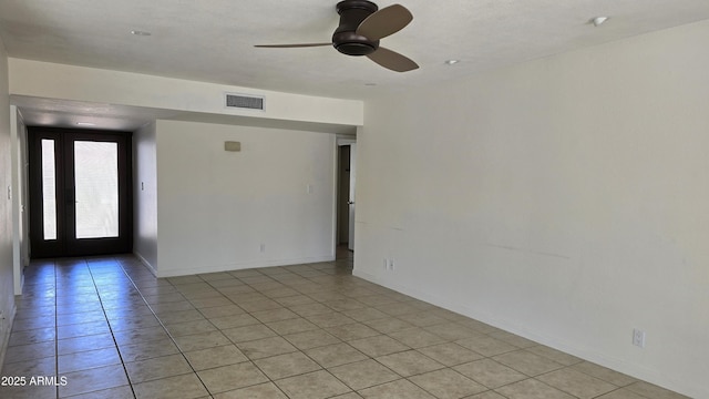 10232 N 86th St, Scottsdale, AZ 85258 - spare room with light tile patterned floors and a ceiling fan