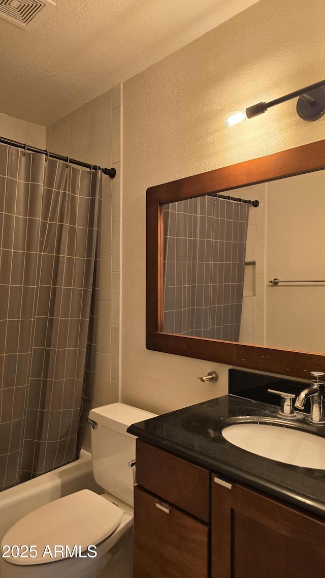 10232 N 86th St, Scottsdale, AZ 85258 - full bathroom featuring vanity, shower / tub combo, and a textured ceiling